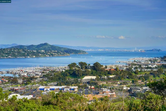 a small pool with lawn chairs
