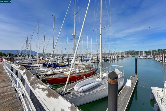 a front view of a house with a fountain