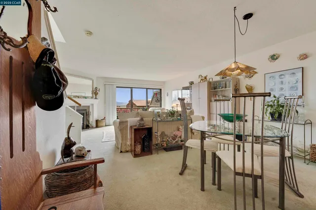 a living room with furniture large window and a flat screen tv