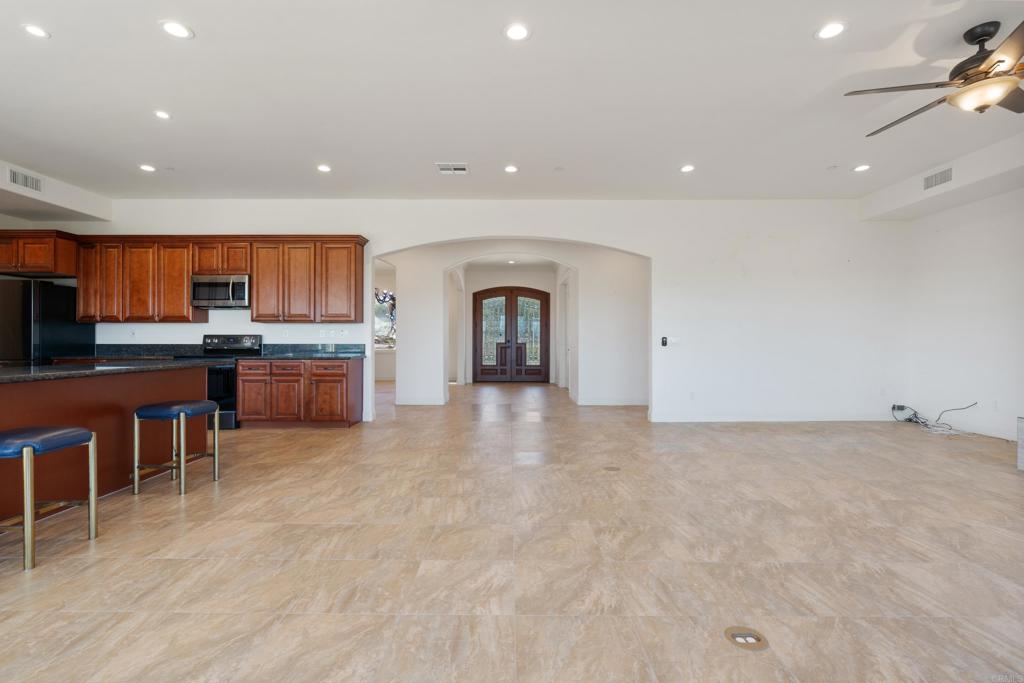 4261 Entrada Al Sol Bonsall, CA 92003 - Photo 18 of 49 a view of a kitchen with a sink and cabinets