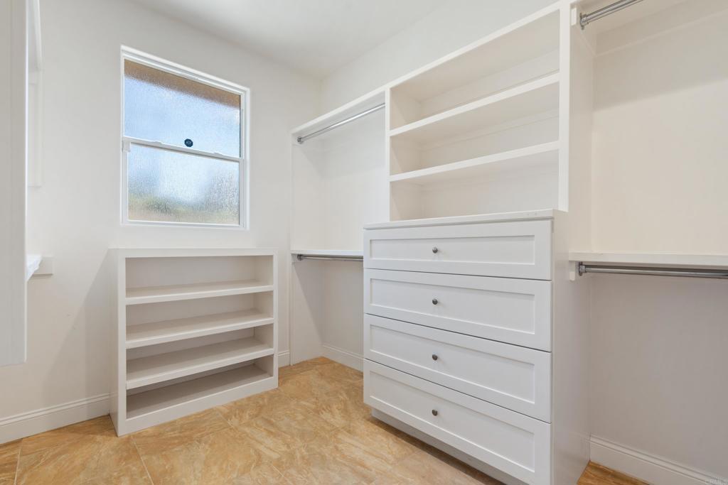 4261 Entrada Al Sol Bonsall, CA 92003 - Photo 25 of 49 a view of an empty walk in closet
