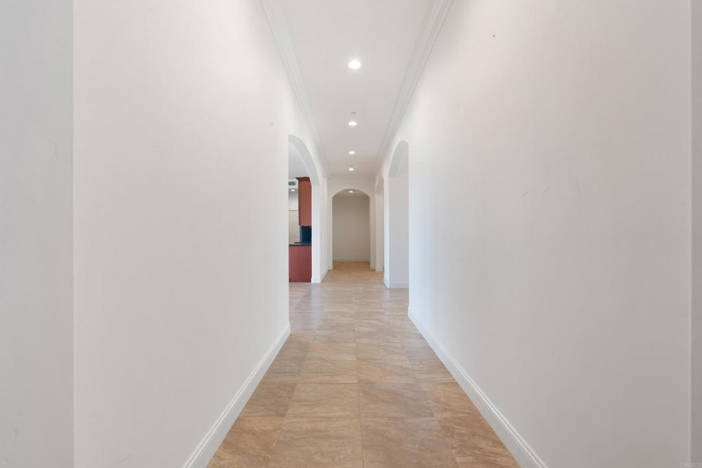 4261 Entrada Al Sol Bonsall, CA 92003 - Photo 27 of 49 a view of a hallway with wooden floor