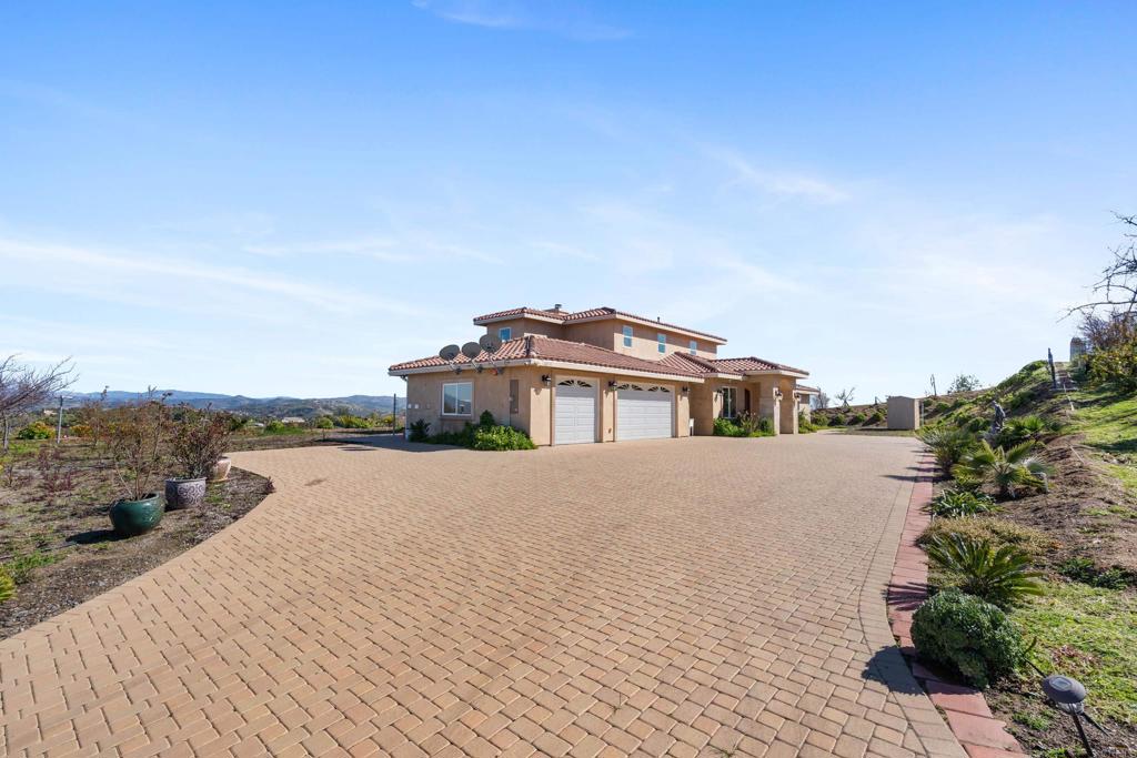4261 Entrada Al Sol Bonsall, CA 92003 - Photo 3 of 49 a view of a house with roof deck