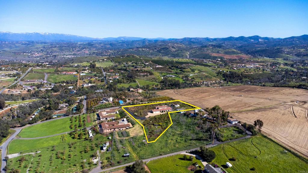 4261 Entrada Al Sol Bonsall, CA 92003 - Photo 5 of 49 an aerial view of residential house and sandy dunes