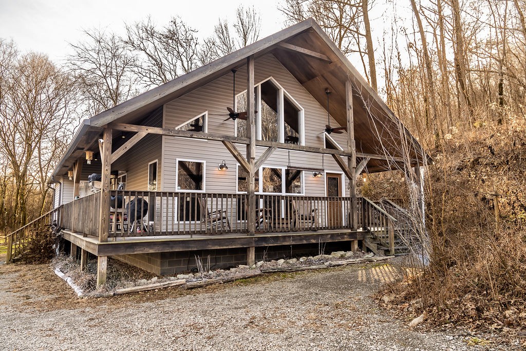 50 Hot Rock Hollow Road Fayetteville, TN 37334 - Photo 1 of 31 a view of a house with large windows and a small yard
