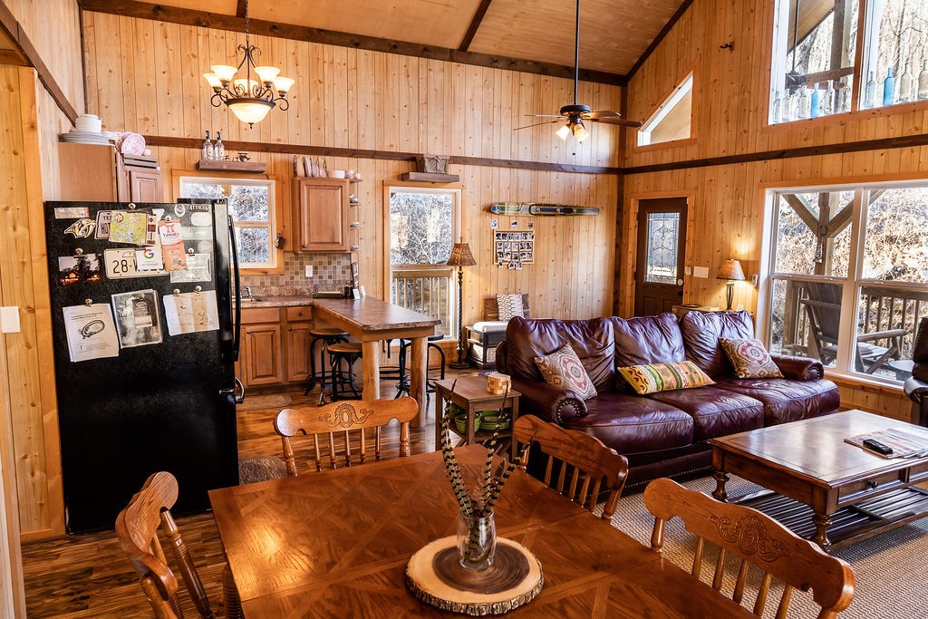50 Hot Rock Hollow Road Fayetteville, TN 37334 - Photo 12 of 31 a living room with furniture a chandelier and a floor to ceiling window