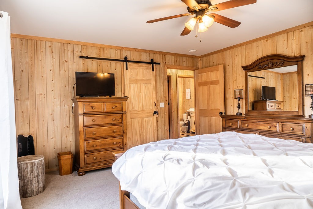 50 Hot Rock Hollow Road Fayetteville, TN 37334 - Photo 17 of 31 a bedroom with a bed and a flat screen tv