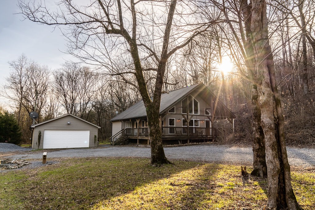 50 Hot Rock Hollow Road Fayetteville, TN 37334 - Photo 28 of 31 a view of a house with a yard covered in snow