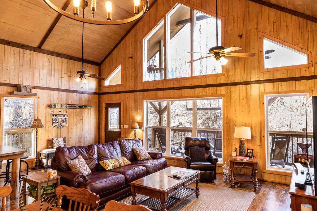 50 Hot Rock Hollow Road Fayetteville, TN 37334 - Photo 4 of 31 a living room with furniture a flat screen tv and floor to ceiling windows