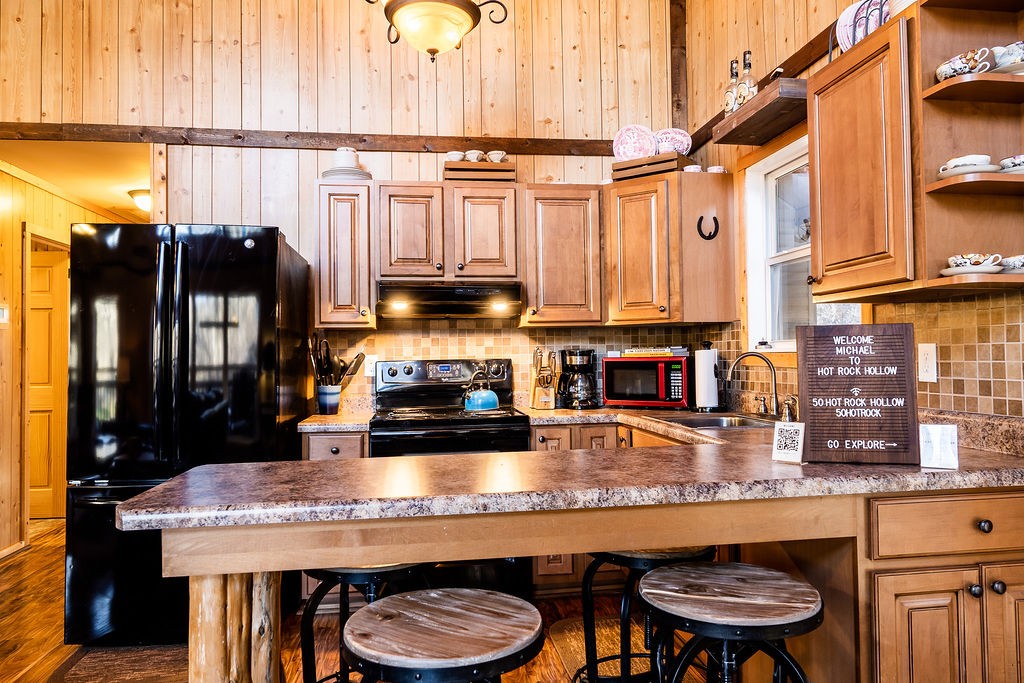 50 Hot Rock Hollow Road Fayetteville, TN 37334 - Photo 8 of 31 a kitchen with stainless steel appliances granite countertop a stove a refrigerator and a microwave
