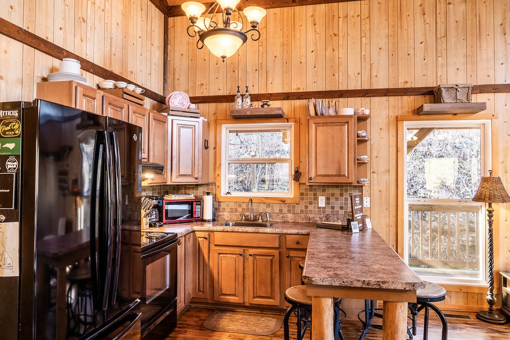 50 Hot Rock Hollow Road Fayetteville, TN 37334 - Photo 9 of 31 a kitchen with stainless steel appliances granite countertop a refrigerator a stove and white cabinets