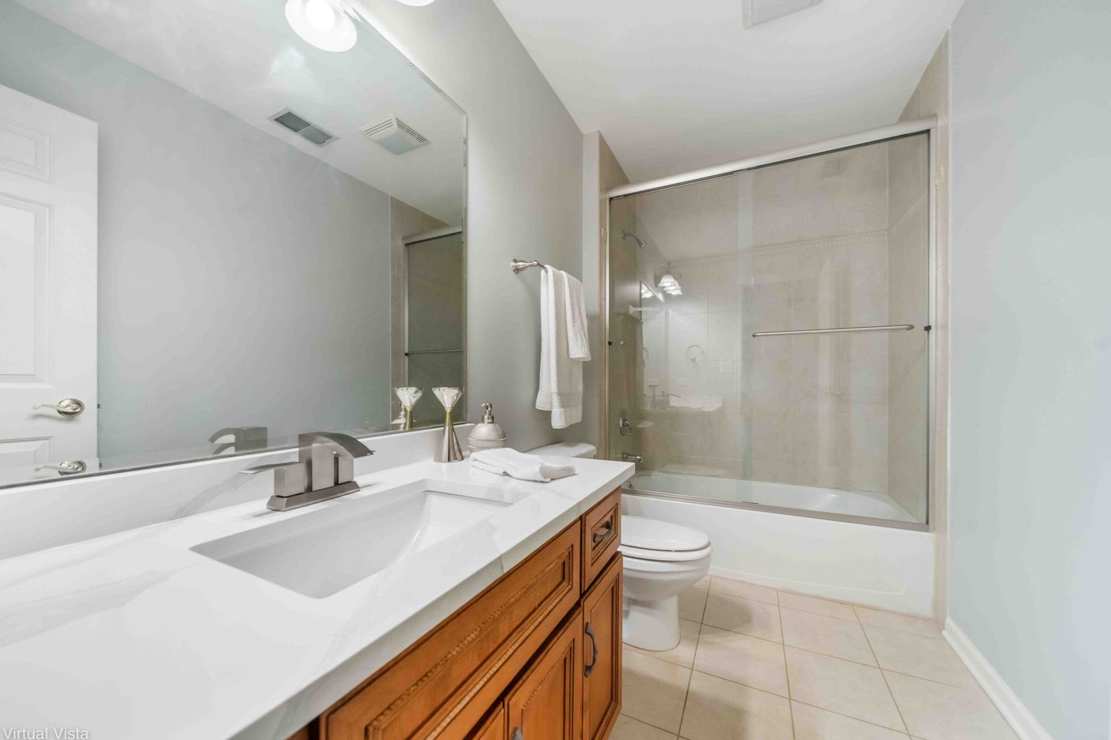 410 North River Road Naperville, IL 60540 - Photo 24 of 29 a bathroom with a sink a toilet and shower