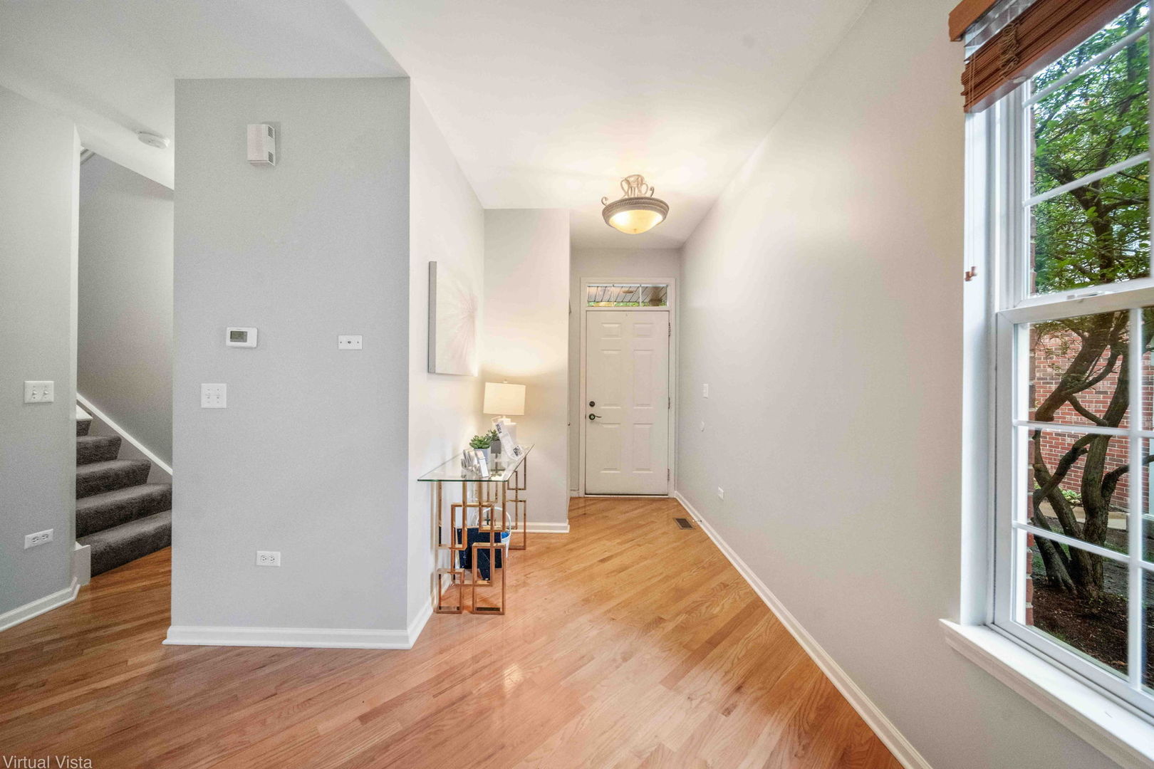 410 North River Road Naperville, IL 60540 - Photo 3 of 29 wooden floor in an empty room with a window