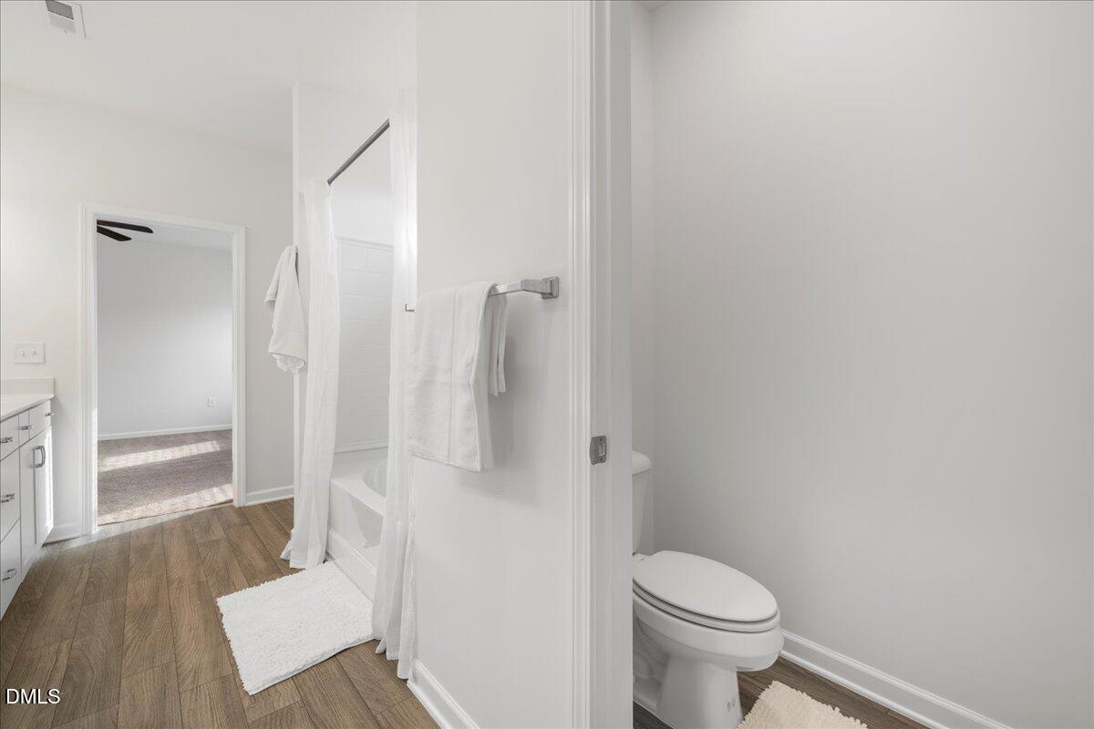 125 Flying Point Lane Clayton, NC 27520 - Photo 30 of 50 a bathroom with a toilet and a shower