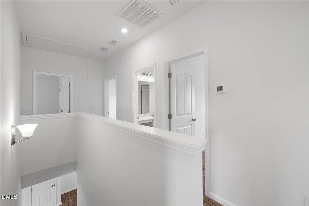 125 Flying Point Lane Clayton, NC 27520 - Photo 31 of 50 a bathroom with a sink and a mirror