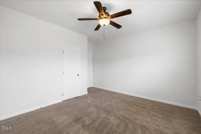 a view of a small space with wooden floor