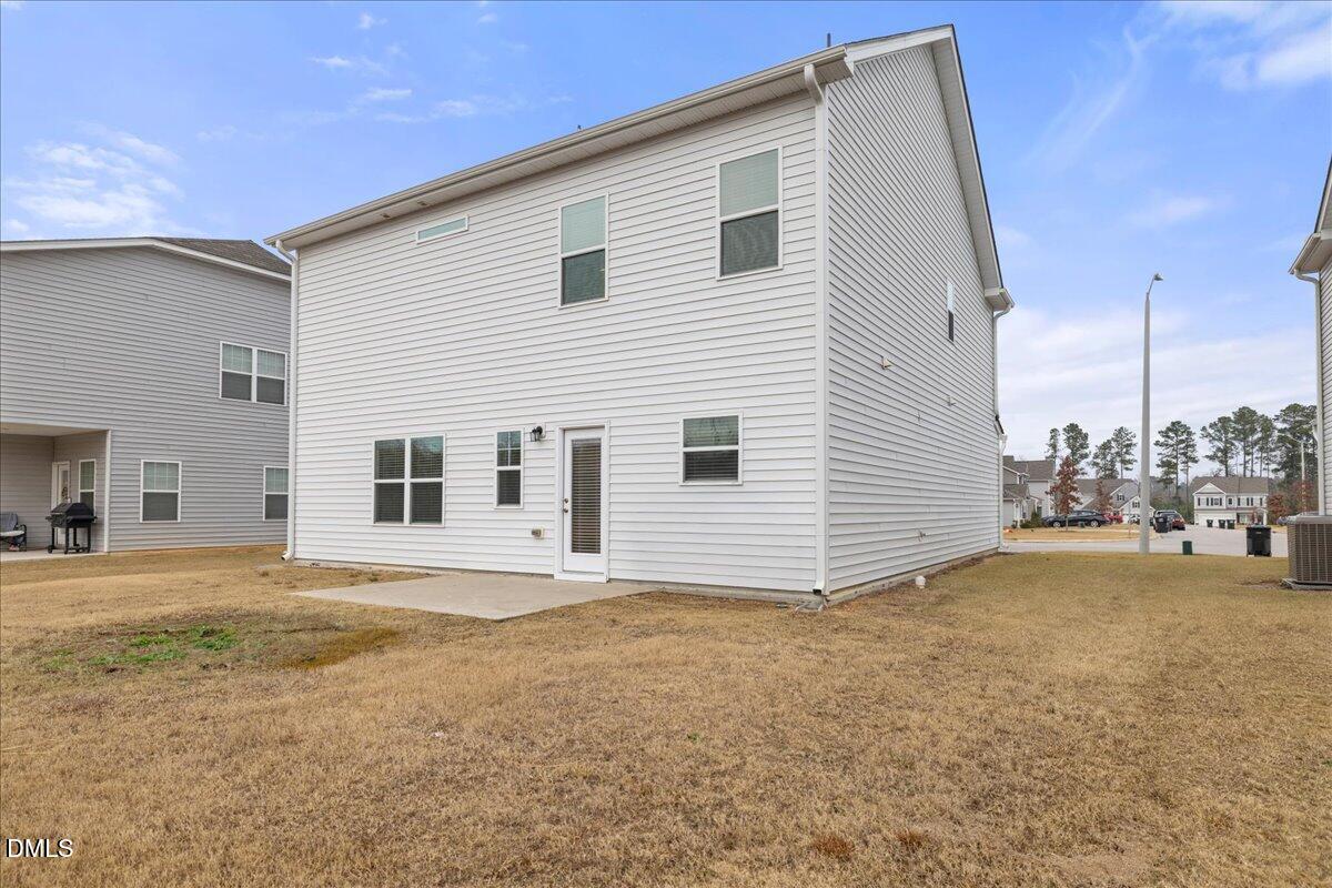 125 Flying Point Lane Clayton, NC 27520 - Photo 42 of 50 a view of a house with backyard and sitting area