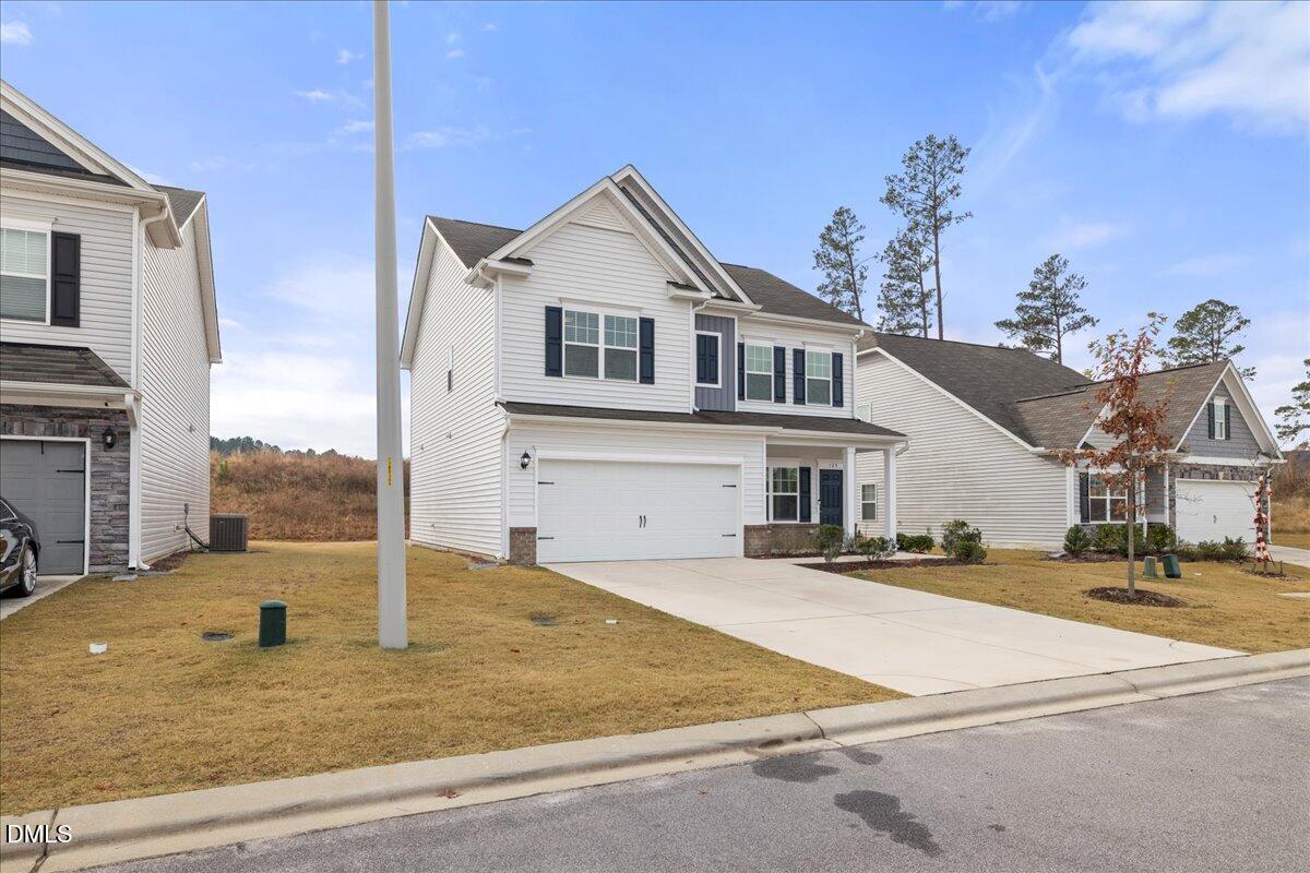125 Flying Point Lane Clayton, NC 27520 - Photo 3 of 50 a view of a house with a entertaining space