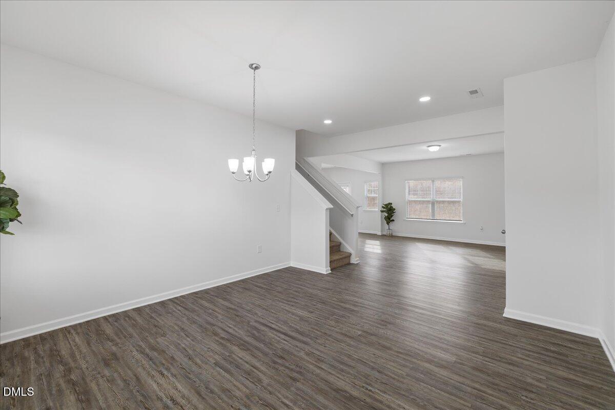 125 Flying Point Lane Clayton, NC 27520 - Photo 7 of 50 wooden floor in an empty room with a window