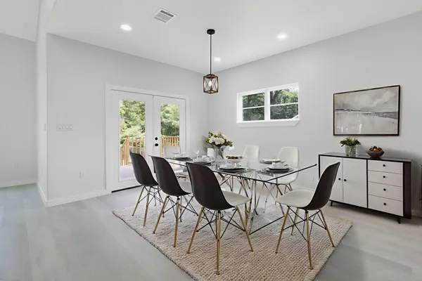 a view of a dining room with furniture window and wooden floor
