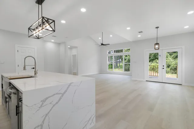 a view of a kitchen with a sink and window