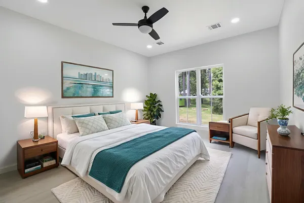 a bedroom with a bed and a couch