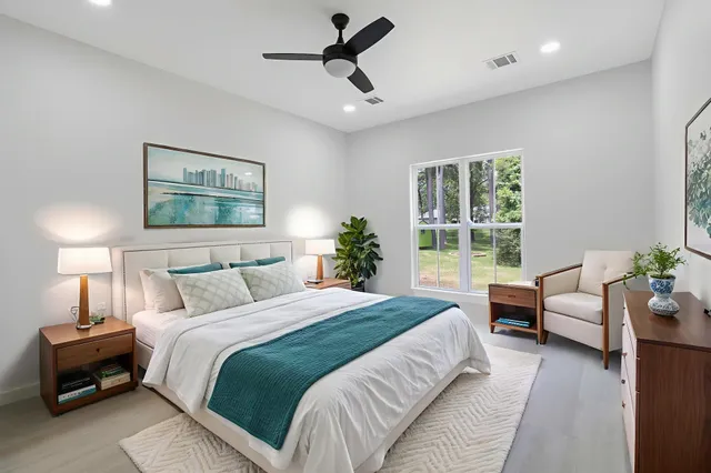 a bedroom with a bed and a couch