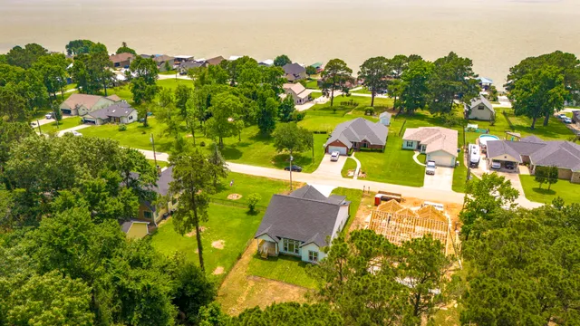 an aerial view of houses with yard