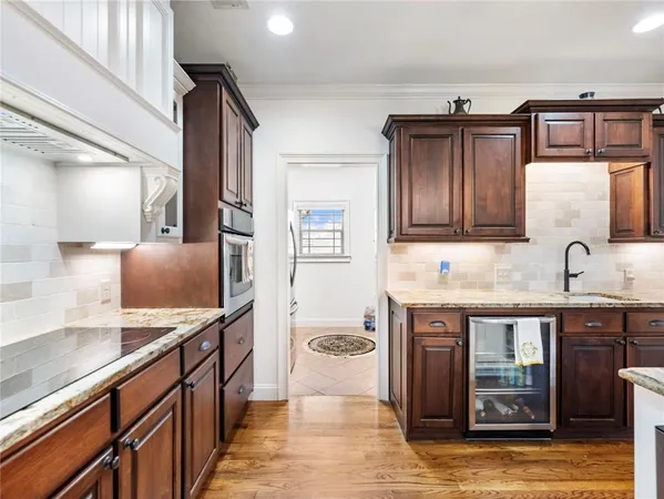 a kitchen with lots of bottles of alcohol