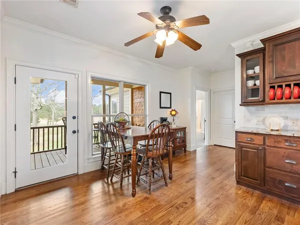 a bathroom with a granite countertop double vanity sink and a mirror