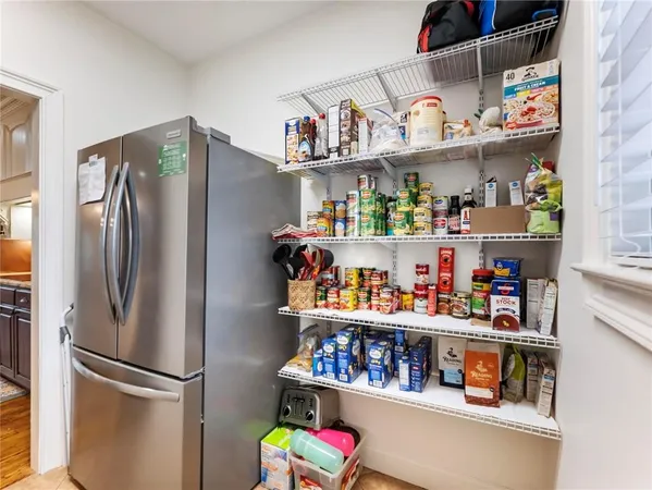 a bathroom with a toilet a sink and a mirror