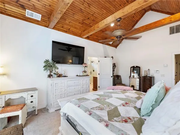 a view of a balcony with furniture and wooden floor