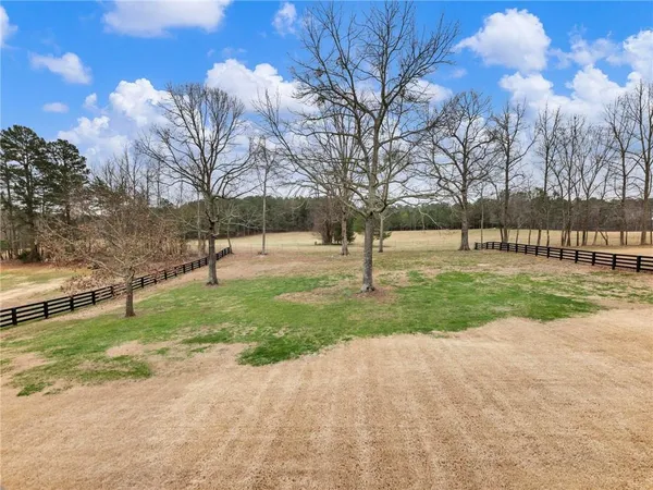 a view of a livingroom with a ceiling fan and a window