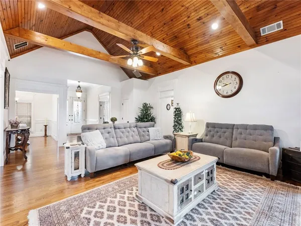 a kitchen with stainless steel appliances granite countertop a sink and a stove