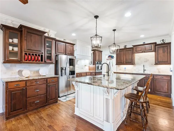 a view of a a dining room with furniture window and wooden floor
