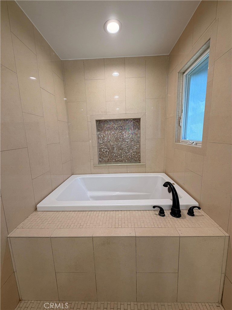5365 Lewis Road Agoura Hills, CA 91301 - Photo 11 of 21 a bathroom with a bathtub