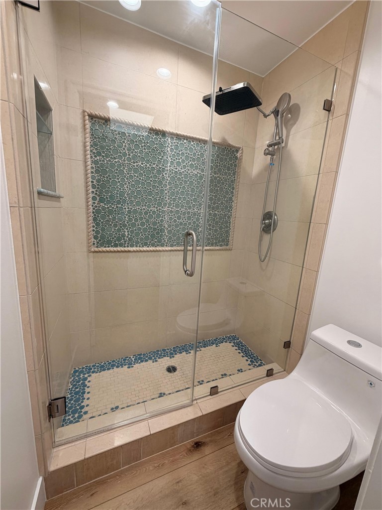 5365 Lewis Road Agoura Hills, CA 91301 - Photo 15 of 21 a bathroom with a toilet and a shower