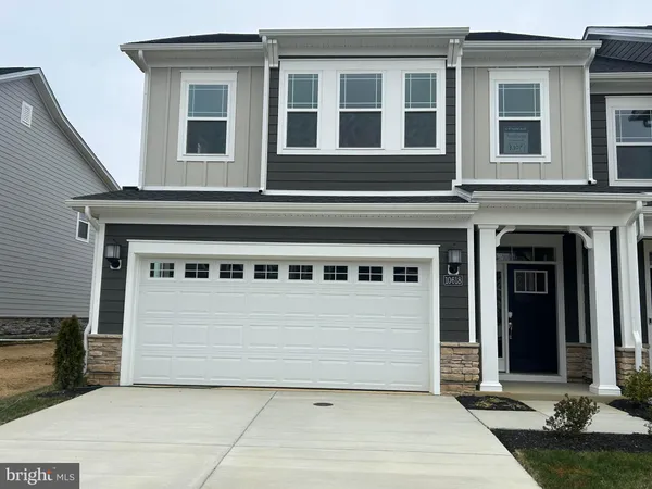 a view of a house with more windows and brick walls