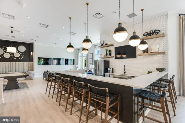 a kitchen with a table and chairs in it