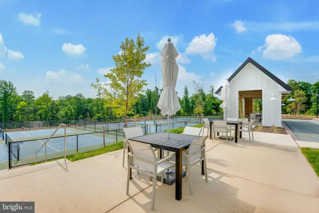a wooden table and chairs in a kitchen
