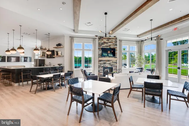 a view of living room with wooden floor and ceiling fan
