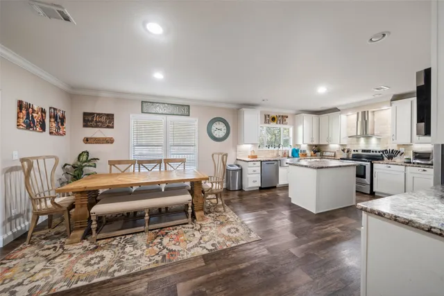 a living room with granite countertop furniture and a large window