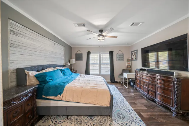 a bed room with a bed and a television