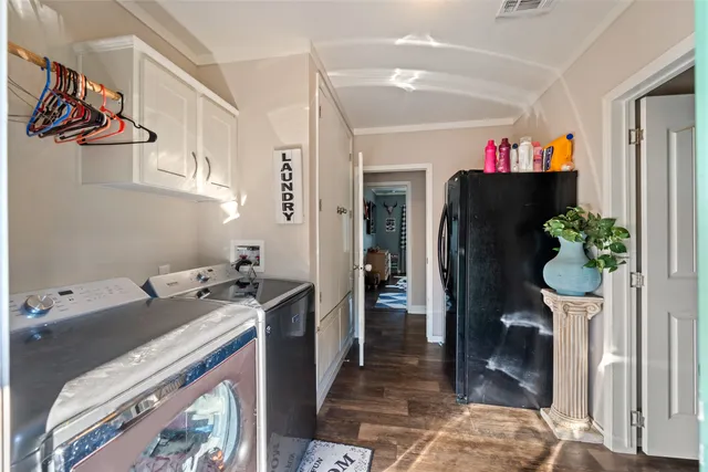 a view of a porch with furniture and wooden floor