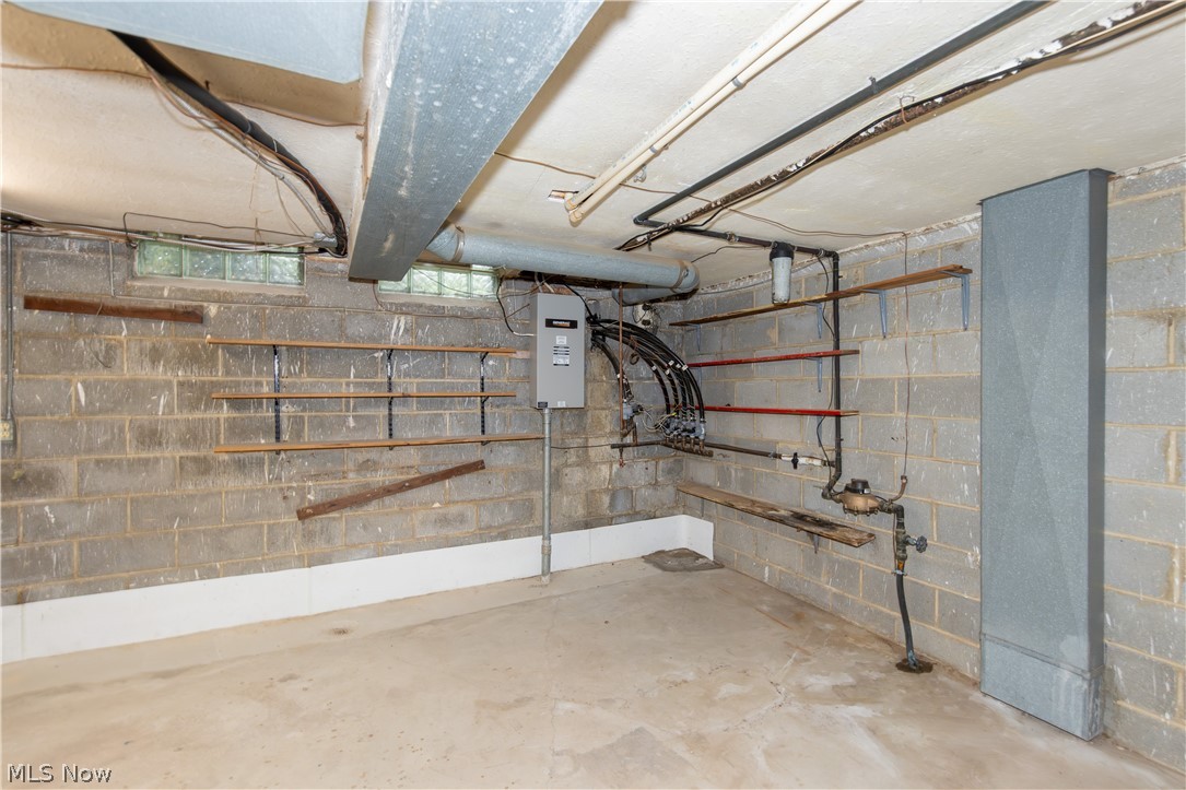 25001 Letchworth Road Beachwood, OH 44122 - Photo 41 of 50 Unfinished basement space with concrete block walls and a concrete floor