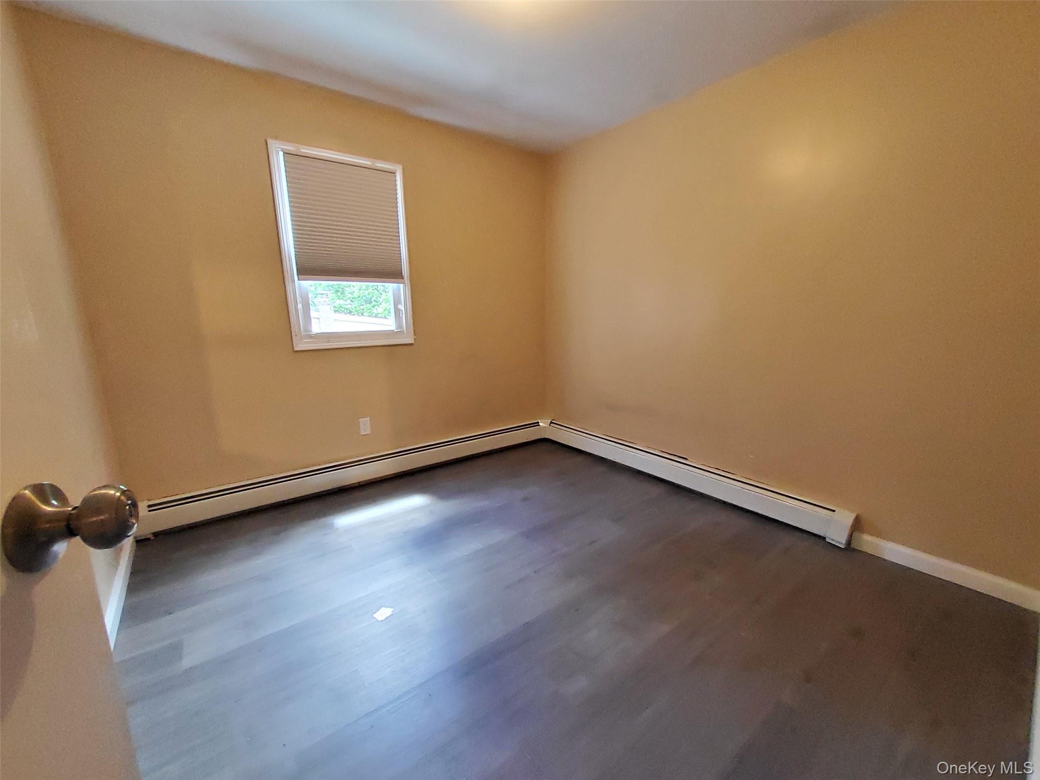 469 Hillside Road Monroe, NY 10950 - Photo 8 of 20 an empty room with a workbench