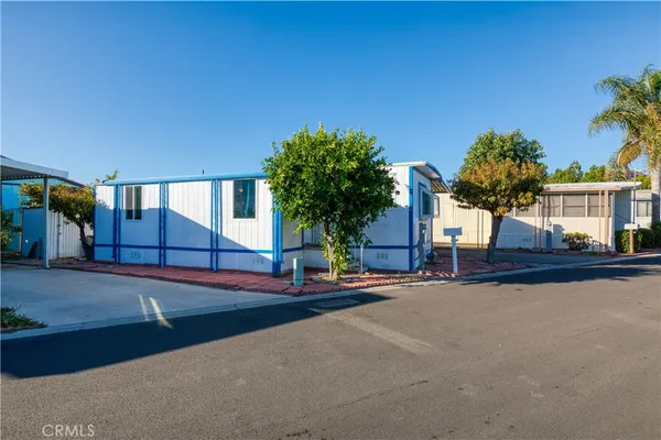 a view of a house with basketball court