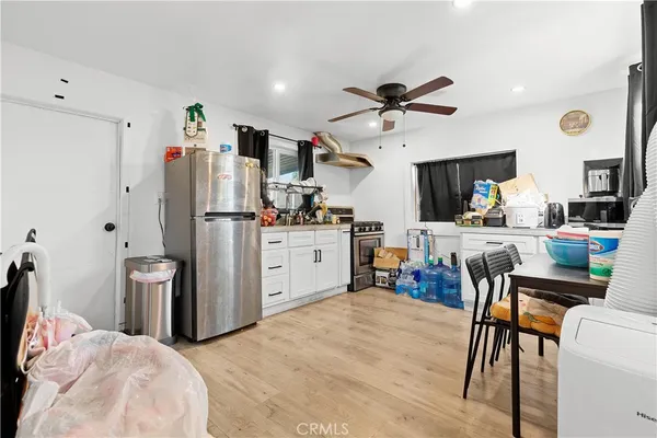 a view of play room with toys and wooden floor