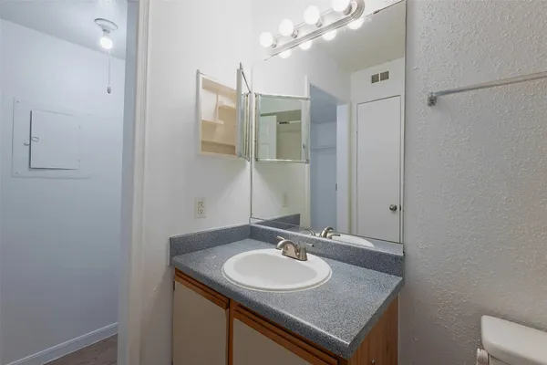 a bathroom with a sink and a mirror