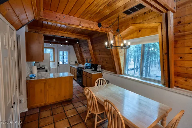 a view of a dining room with furniture window and outside view